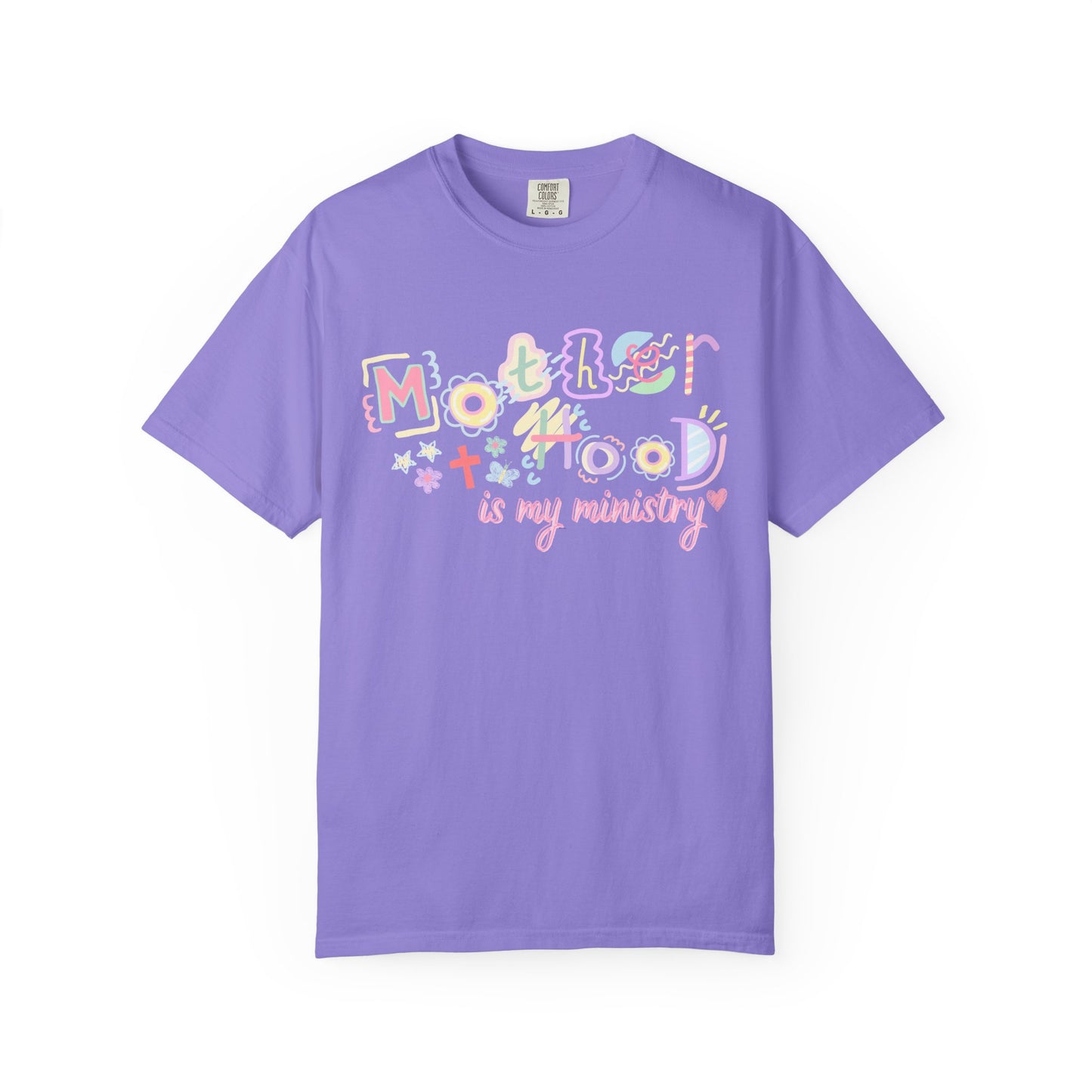 Purple t-shirt with colorful text  "motherhood is my ministry" design on a white background