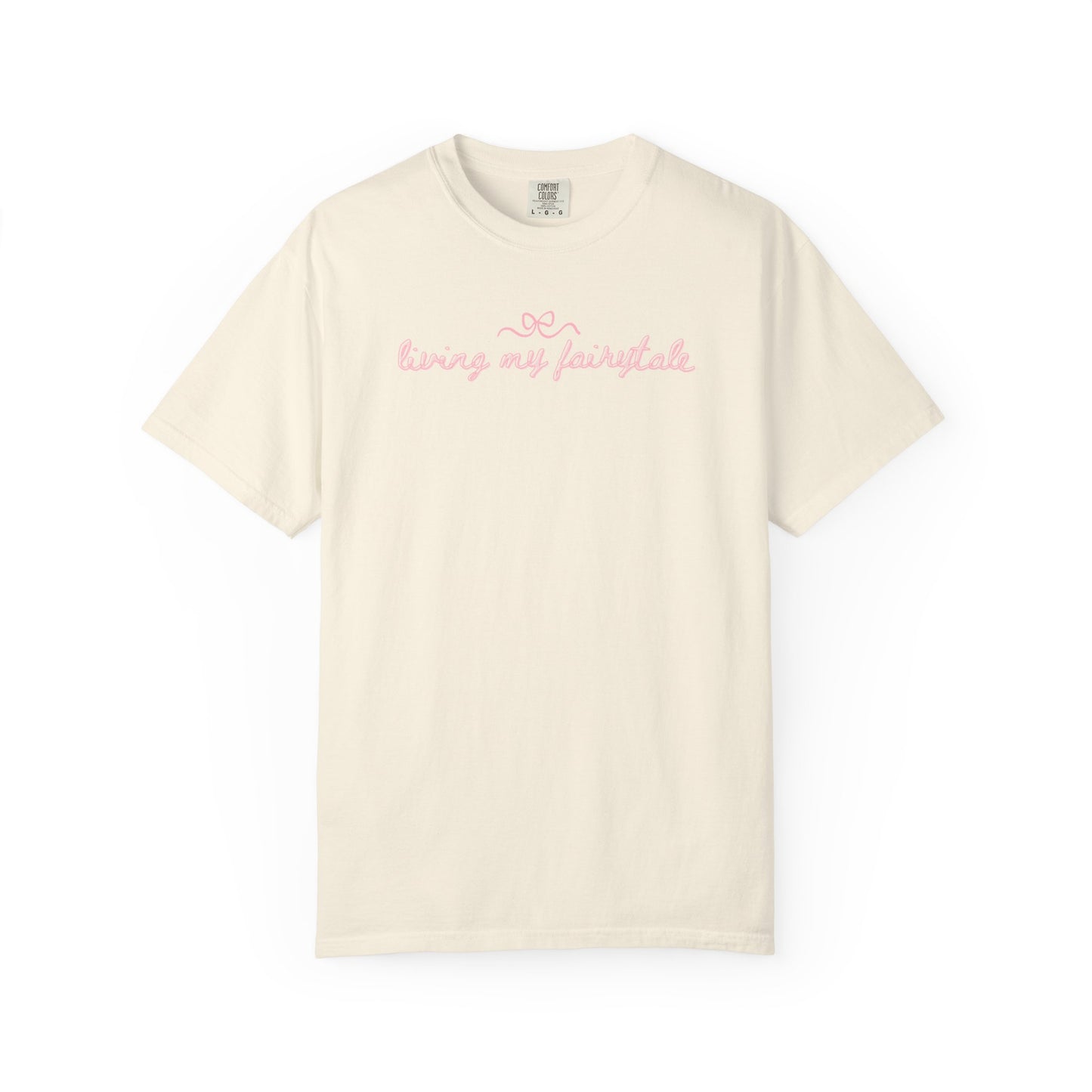 Beige t-shirt with 'living my fairytale" print on a white background