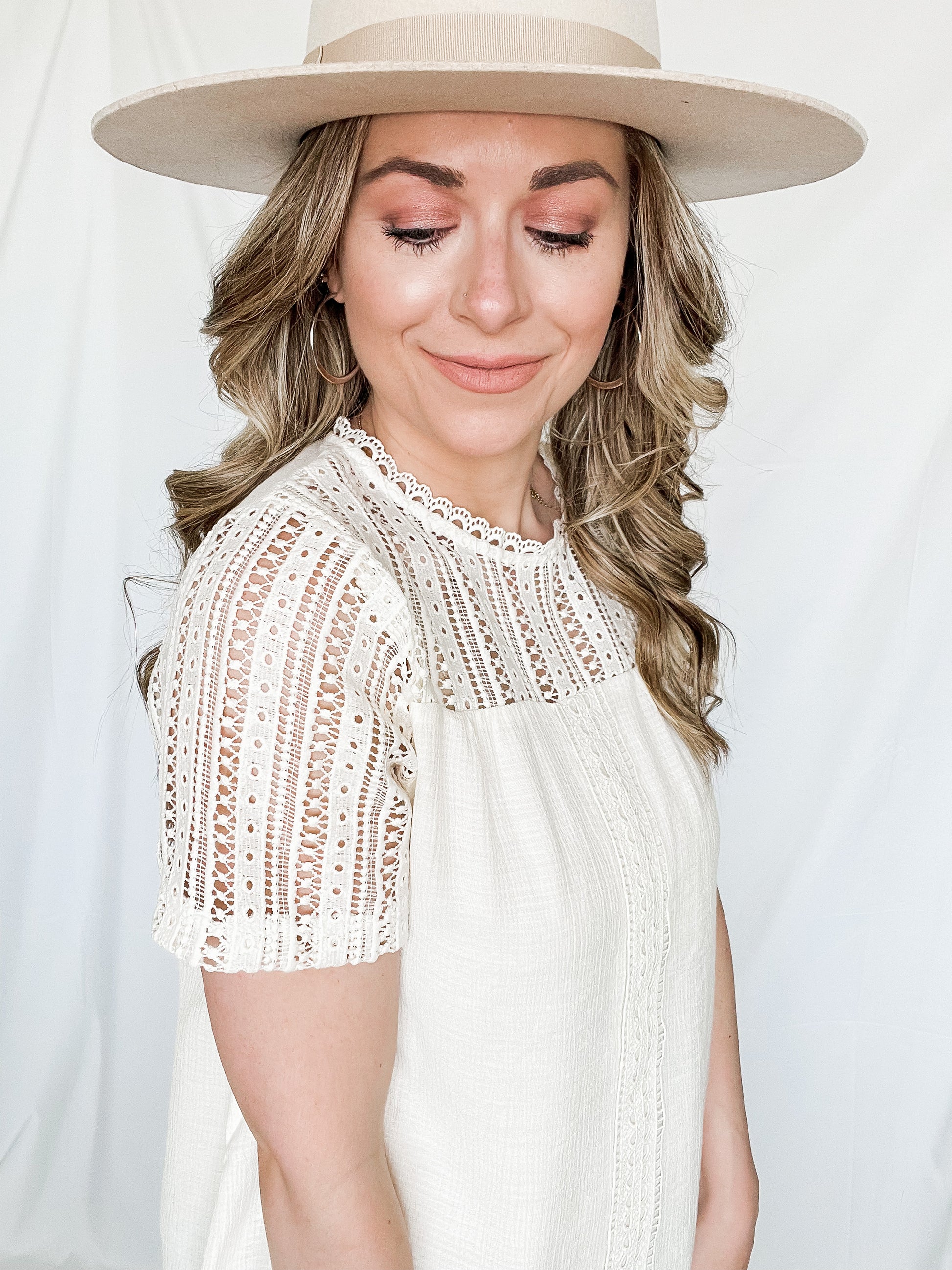 Lacey spring top ivory color with lace detailing on neckline and shoulders closeup front view