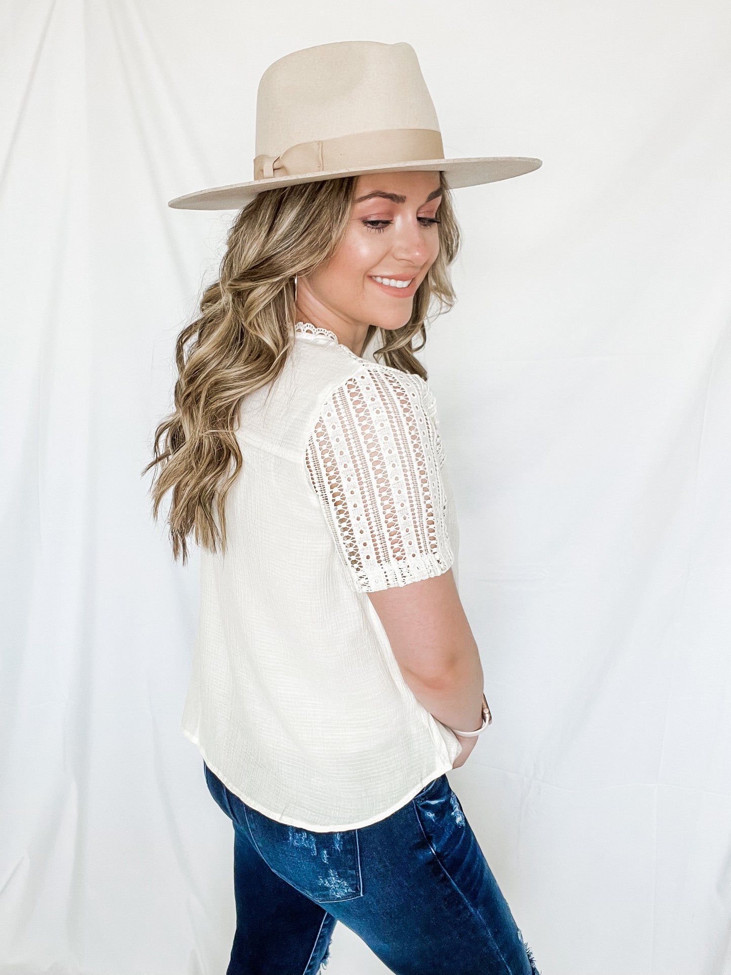 Lacey spring top ivory color with lace detailing on neckline and shoulders side view