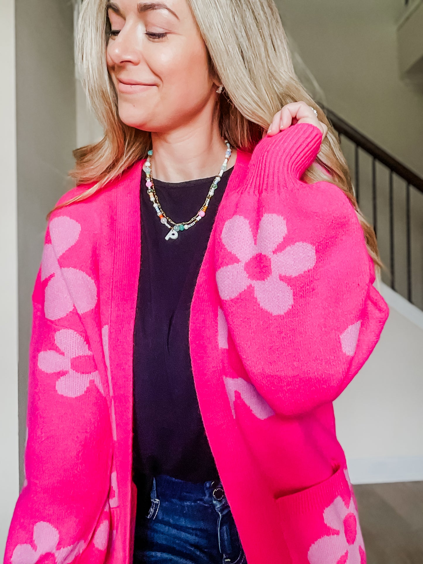 closeup of Enough Anyways Floral Cardigan in bright pink and soft pink flowers