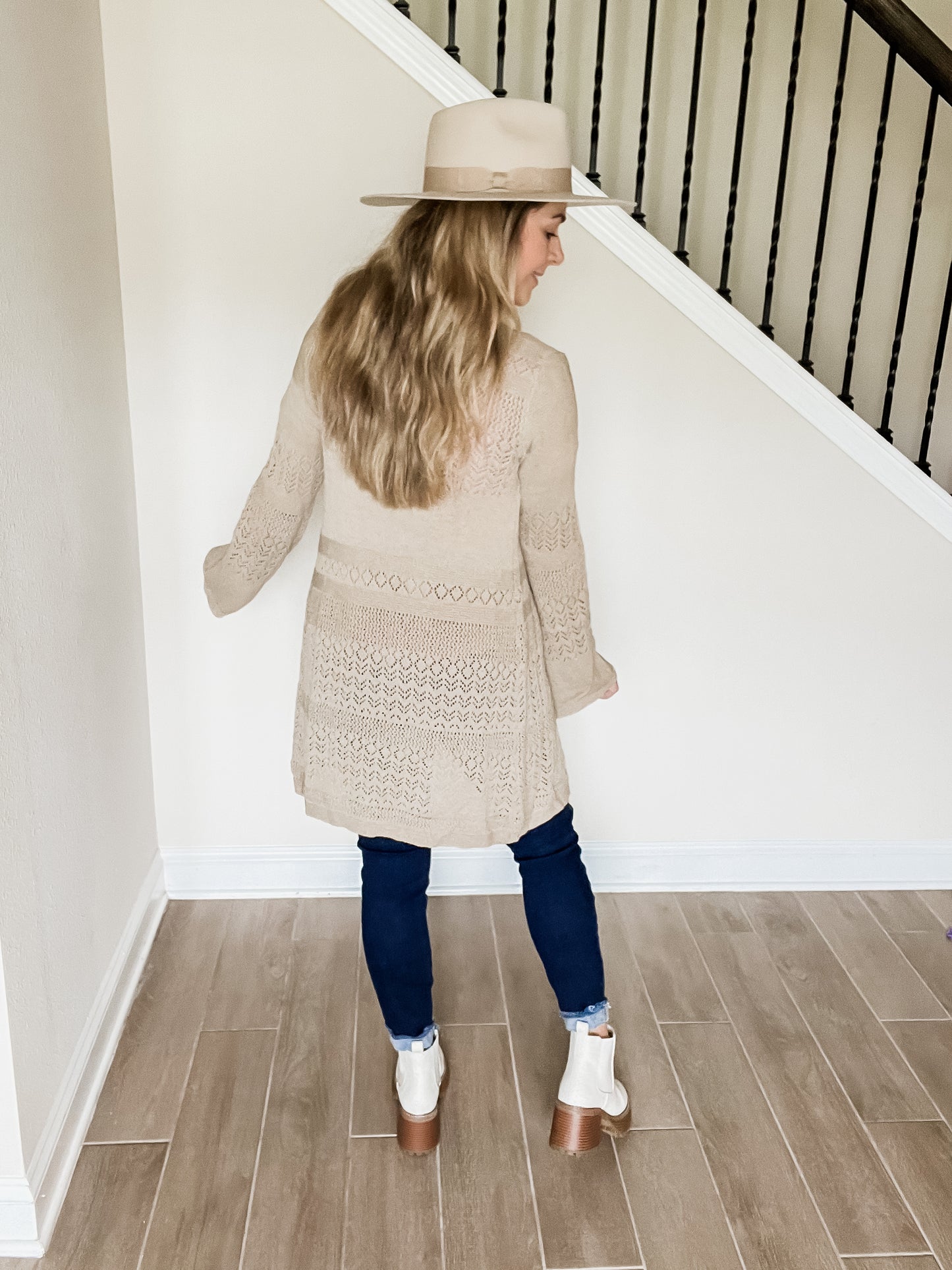 kindly knit cardigan in taupe color with elegant knitted material that is longer length back view