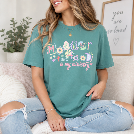 Motherhood is my ministry text design on shirt. 